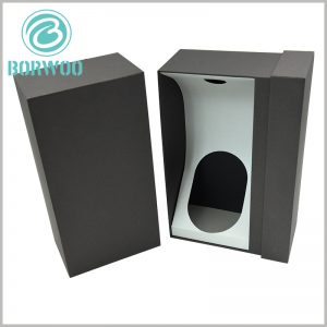black cardboard drawer boxes for wine bottles packaging. The inside of the custom packaging box has white cardboard as an insert to fix the neck and bottom of the wine bottle to ensure the stability of the product.