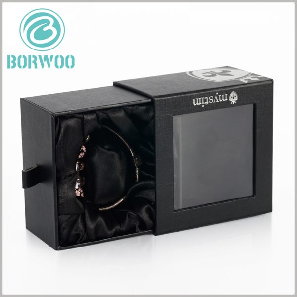custom black bracelets gift boxes with windows. There are inserts and black silk cloth inside the package to fix and protect the bracelet jewelry.