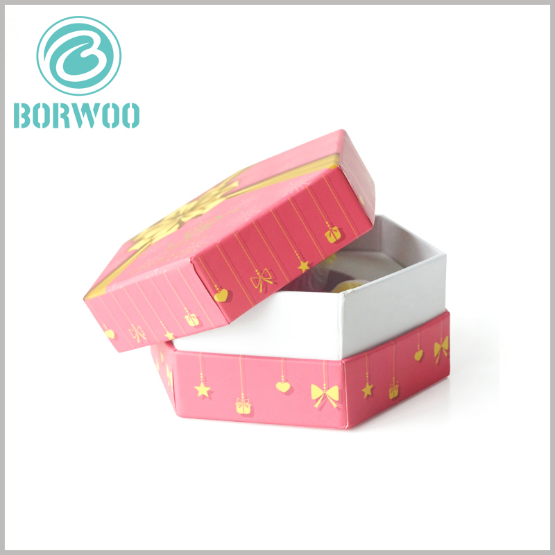 80ml perfume spray bottle packaging with bronzing printing. The printed hexagonal cardboard boxes, the packaging is hard, can isolate the external damage to the perfume products inside the packaging.