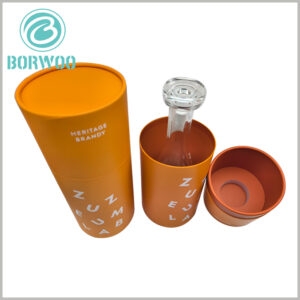 High-end wine bottle tube packaging boxes, the inside of the paper tube is orange, the inside of the top is also orange, and even the surface of the sponge is the same orange, the overall look is very high-end