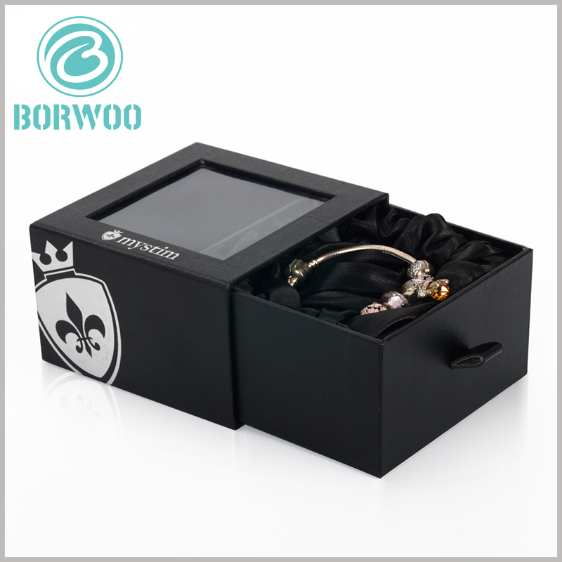 black small bracelets gift boxes with windows. There are PVC windows on the top of the black cardboard drawer boxes, you can directly see the product style, which is the best way to promote the product.