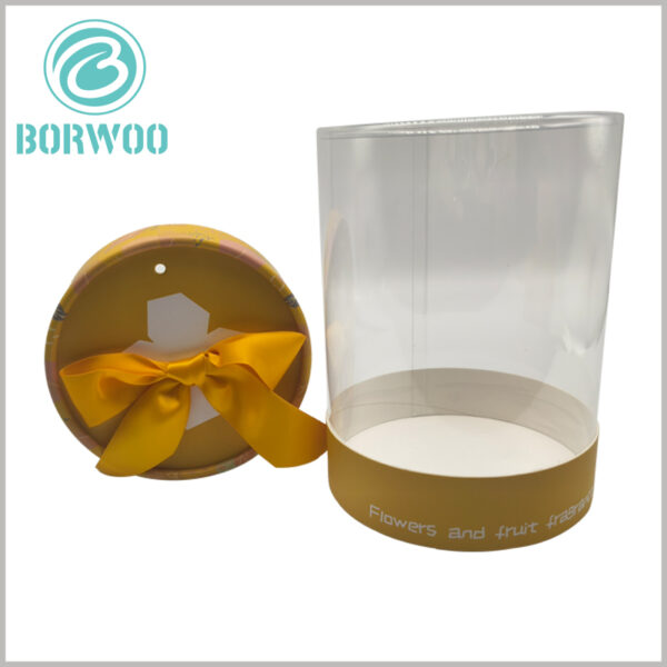 clear cylinder tube packaging with paper lid and gift bow wholesale, the size of the tube packaging can be customized according to the capacity of your products