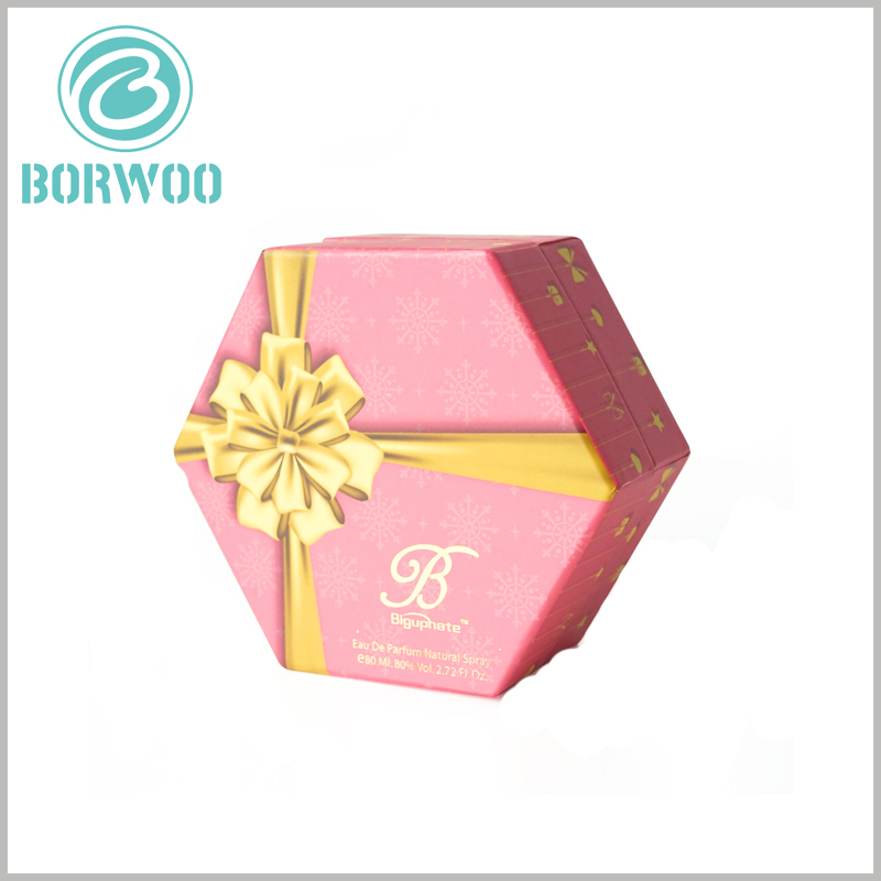 custom Hexagonal packaging for perfume spray bottle. In order to reflect the value of perfume gifts, golden gift bows (bronzing+emboss printing) can be printed on the front of perfume gift boxes.