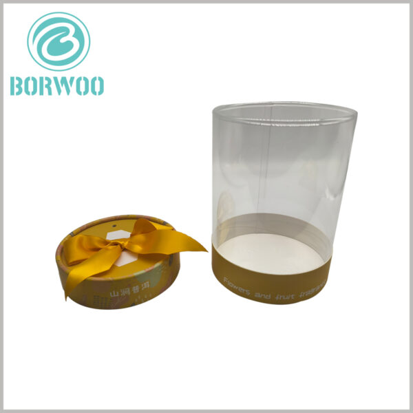 Custom clear cylinder tube packaging with paper lid and gift bow, using unique printed content to reflect the characteristics of the product and brand
