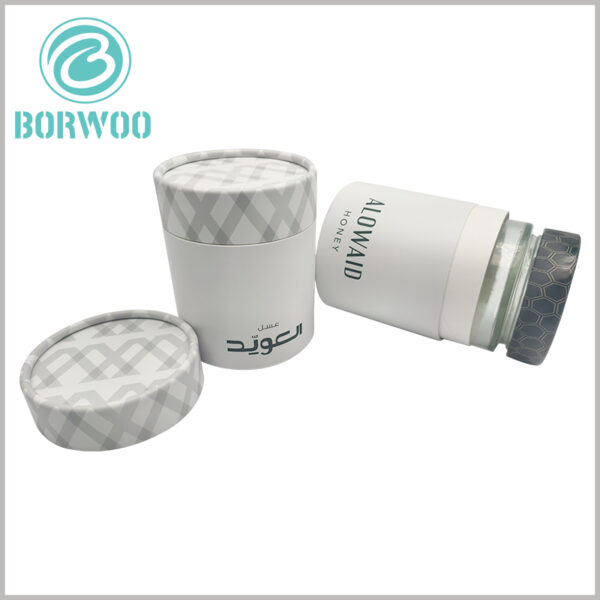 honey jar packaging tube box wholesale. The 250g honey jar can be well embedded into the inside of the paper tube because the size of the product packaging is customizable.